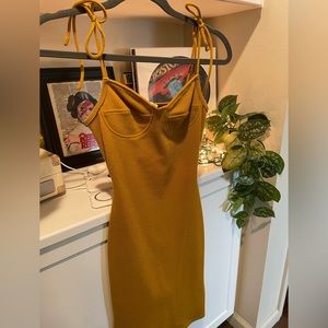 Beautiful mustard, tie strap balconette midi dress.